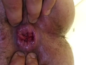 Gay men display their anal gaping abilities.