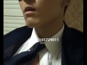 Young Asian boy in bondage gives a handjob