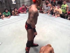 Gay black men engage in wrestling.