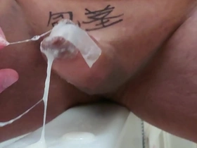 Japanese hunk masturbates with skinshoe and tape cage