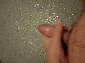 A gay amateur masturbates in the shower with an uncut cock.
