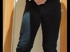 A gay man masturbates with a dildo in a public restroom.