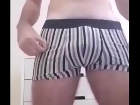Young gay twink masturbates and talks dirty while being filmed by a hidden camera