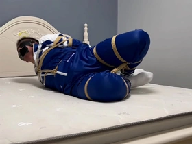 Asian man tied up with ropes and shackles in a gay bondage scene