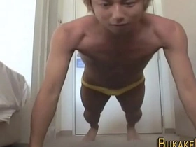 Young Asian boy masturbates and ejaculates on his face